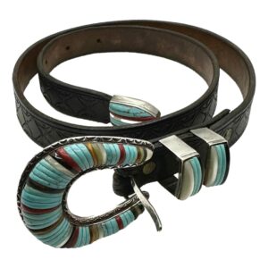 Main photo of Zuni inlaid silver belt displayed coiled like a snake for want of a better description! The buckle is in the foreground and shaped like a horseshoe with multiple stones inlaid mostly turquoise with other stone inlays set alternately. The belt tip is also inlaid as well as the 2 belt loops. The tip is at the centre of the coil. Finished with a tooled black leather strap. A statement belt if ever there was!