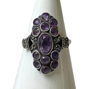 Main photo of 935 silver &amethyst ring displayed on a white cone shaped stand and seen with the ring front forward facing.