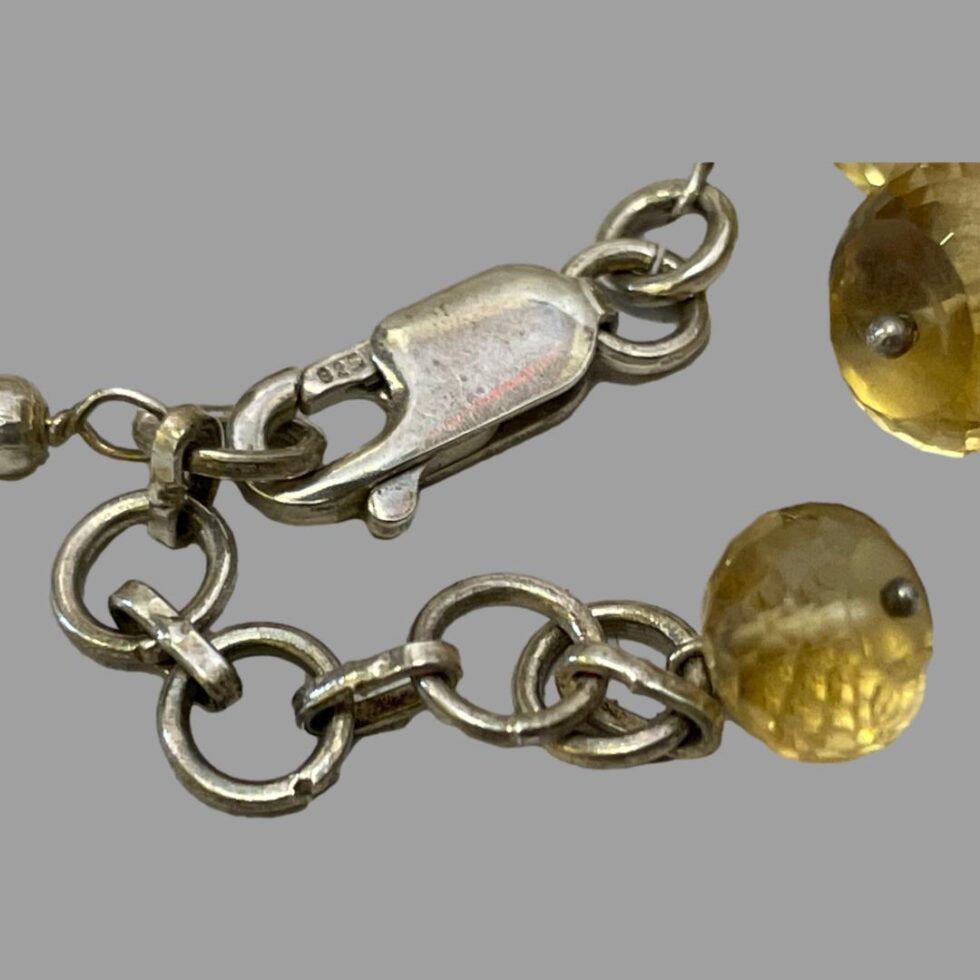 Close up photo of the 925 hallmark on the clasp of the quartz crystal bracelet.