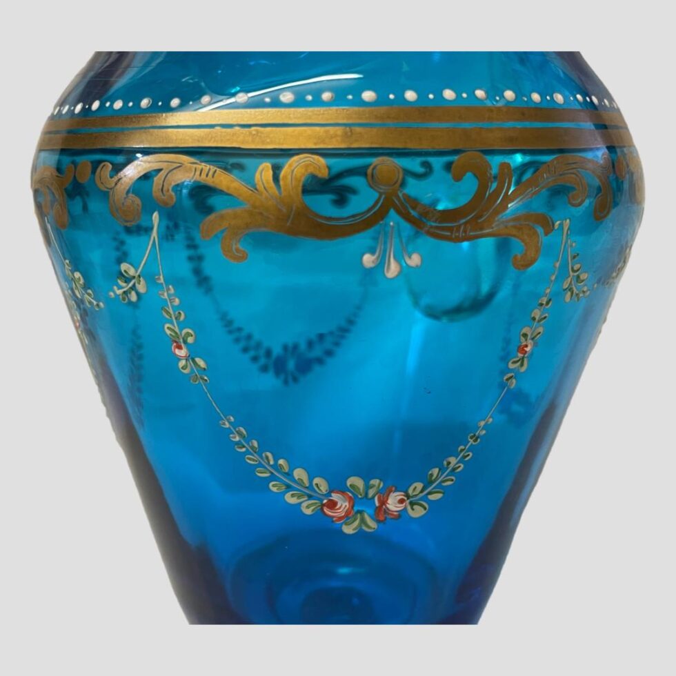 Close up photo of the decorative hand-painting around the lower neck of the jug.