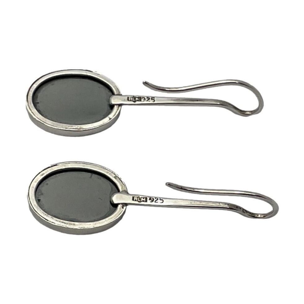 Photo of the back of both earrings showing the hallmark and makers initials RLM to each post.