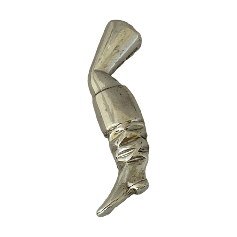 Main photo of booted leg pipe tamper displayed laid flat against a white background and shown vertically. Nice detailing to the boot where ruffles in the 'skin' are visible. The hallmark can just be seen behind the leg at top. Fun item perhaps a little too quirky for some! The leg is quite slender & shapely hence high possibility of it belonging to a highwaywoman !