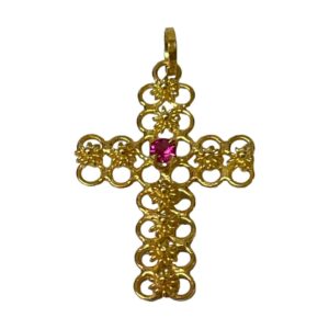 Main photo of 18Kt cross with ruby displayed against a white background with the front of cross forward facing. The gold work of the cross is as explained in description and the ruby which is round cut is a wonderful shade of almost shocking pink.