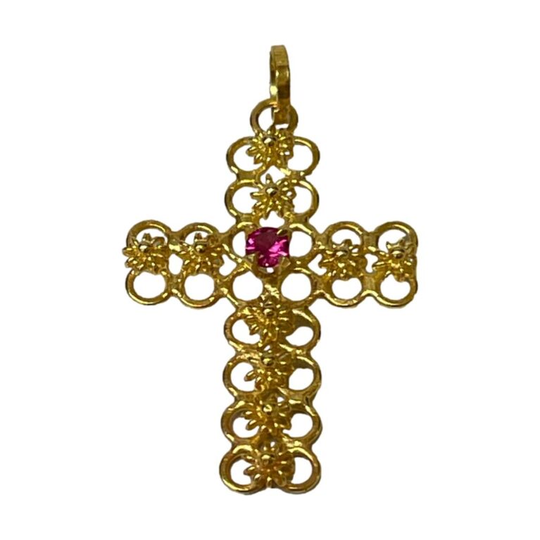 Main photo of 18Kt cross with ruby displayed against a white background with the front of cross forward facing. The gold work of the cross is as explained in description and the ruby which is round cut is a wonderful shade of almost shocking pink.