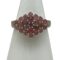 Main photo of silver ruby cluster ring displayed on a white cone shaped stand and seen with the ring front forward facing. This is quite an unusual ring in that the cluster is side wide rather than circular. The rubies are a sweet pale pink and red colour mix which marries well with the silver.