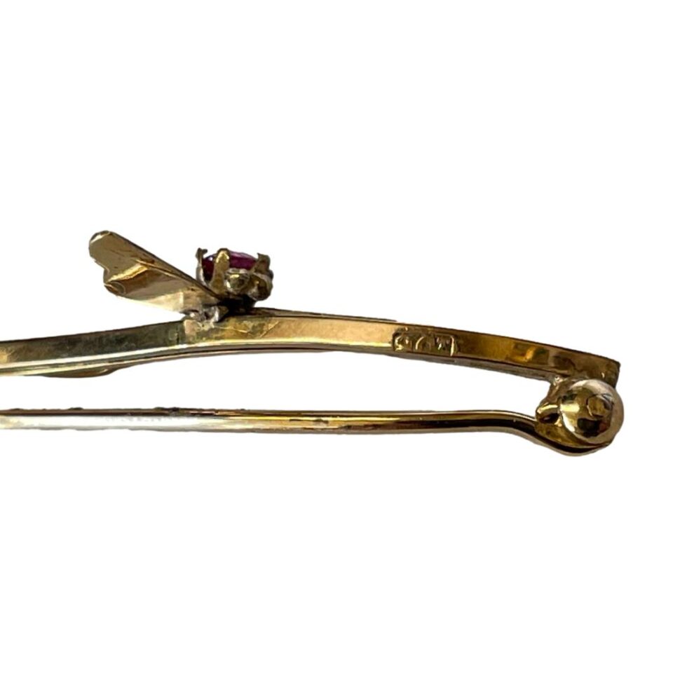 Close up photo of the 9ct hallmark on the side of the brooch bar.