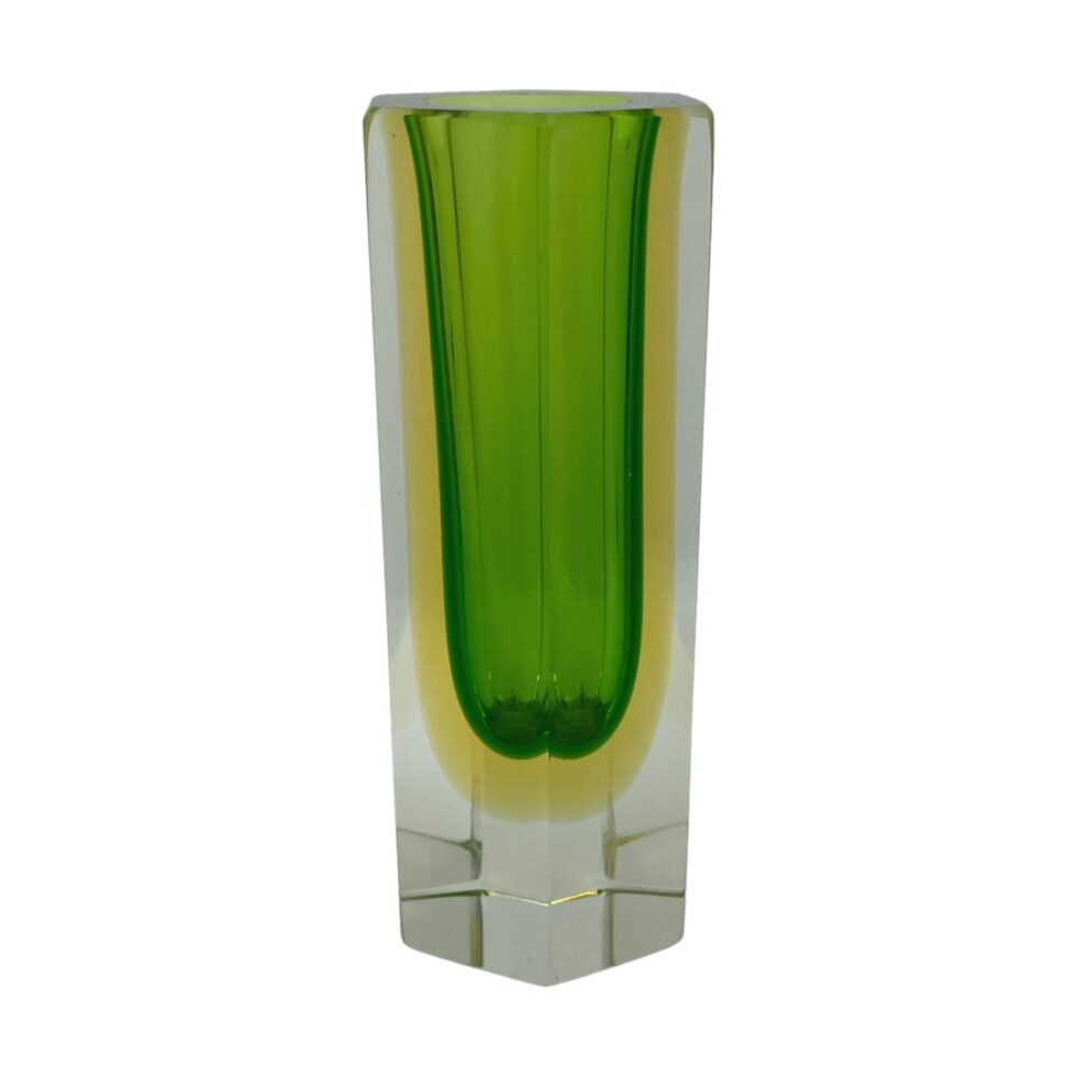 Main photo of mid century Sommerso vase seen from an eye level with the colours neatly within their blocks; clear glass at base and outer edge followed by a yellow line then a block of bright green. Fabulous vase that changes with every different angle.