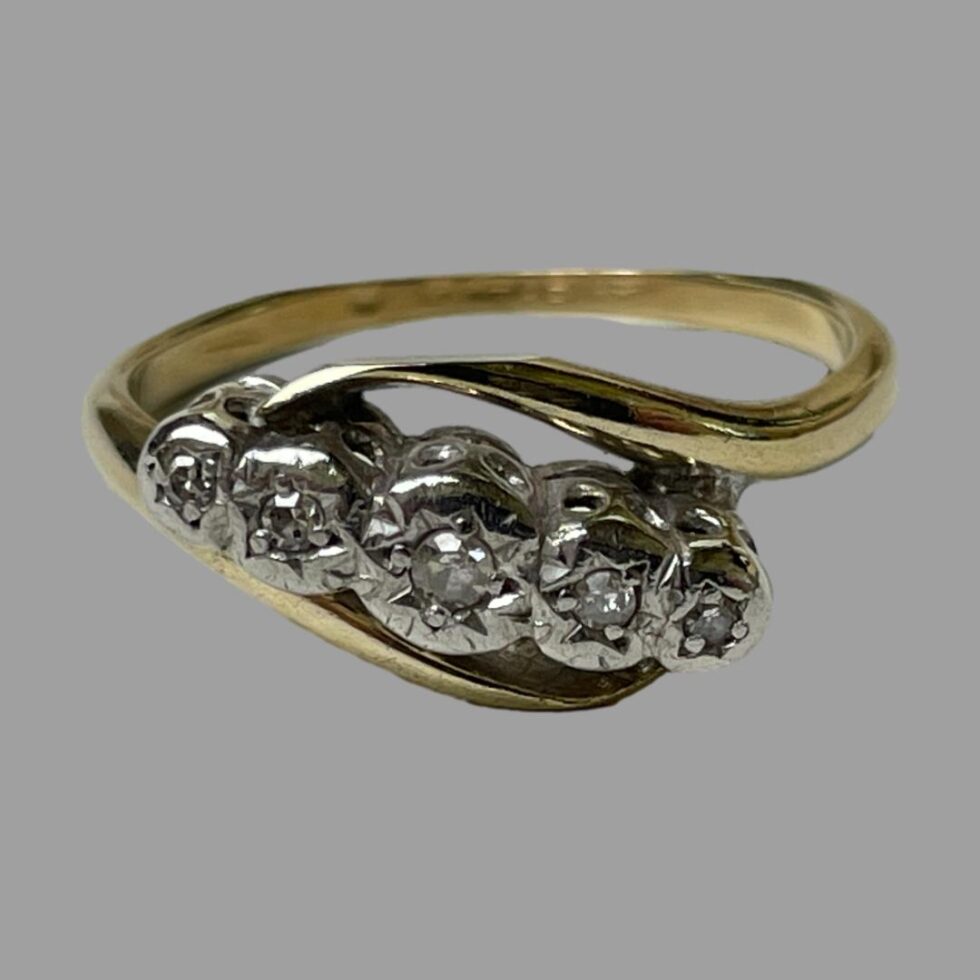 Photo of ring displayed on a flat surface with ring front forward facing.