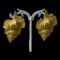 Main photo of designer shell clip-on earrings displayed on a white display stand and set against a black backdrop. The conch shell earrings are in a lovely gilt colour and very realistically crafted. Would look wonderful with a black and golden gown. Very Hollywood!