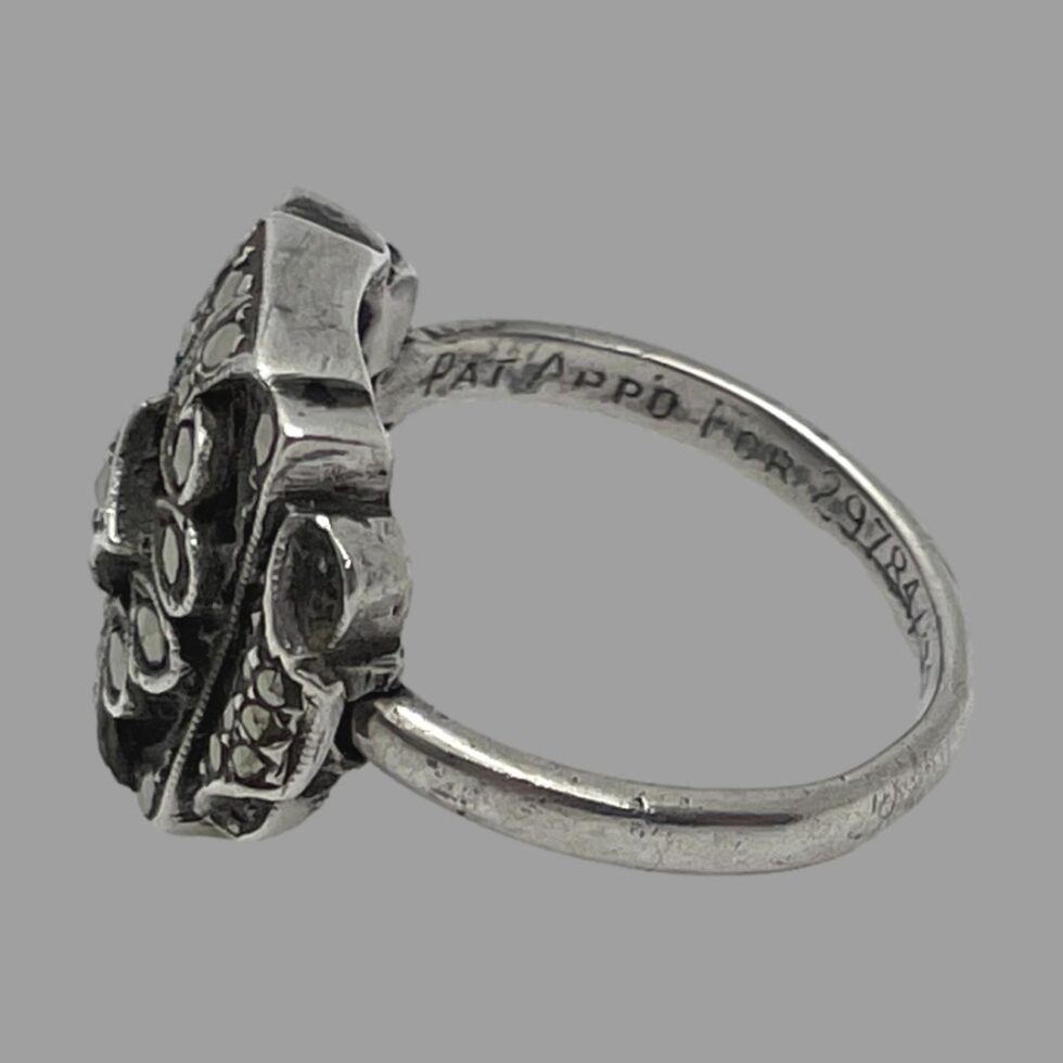 Patent applied for - the start of the writing which is engraved in to the back of ring band.