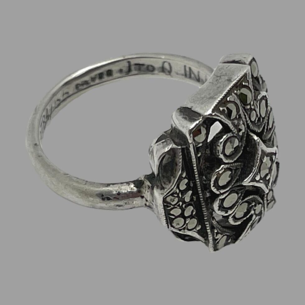 More letting on the inside of band - can make out J to Q here.