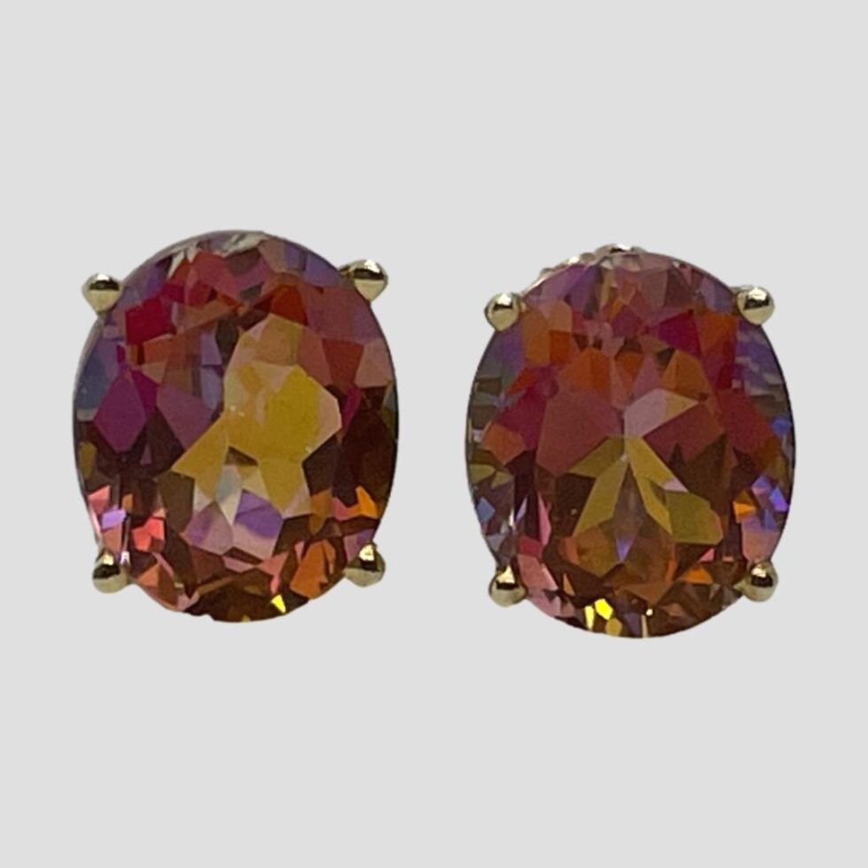 Close up of the mystic topaz 14kt studs in close up from the front. All colours visible here lilac, pink, orange, golden yellow and the light isn't even shining on them!