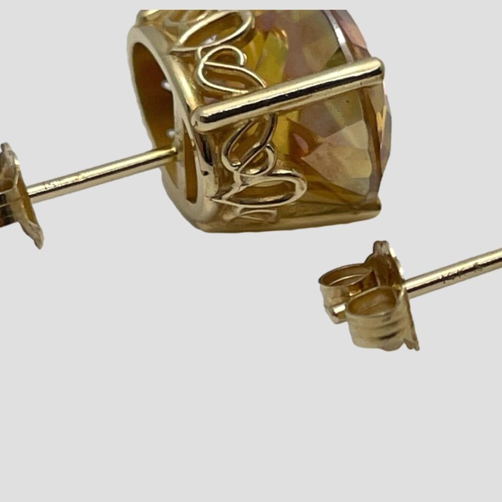 Close up photo of the 14k hallmark on both earring posts.