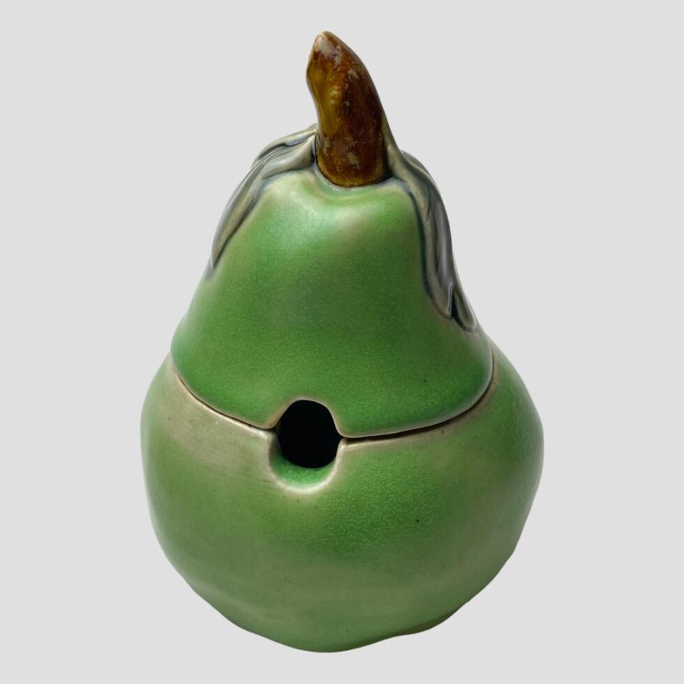 Photo of Doulton pear preserve pot displayed with the gap for the spoon in the foreground.
