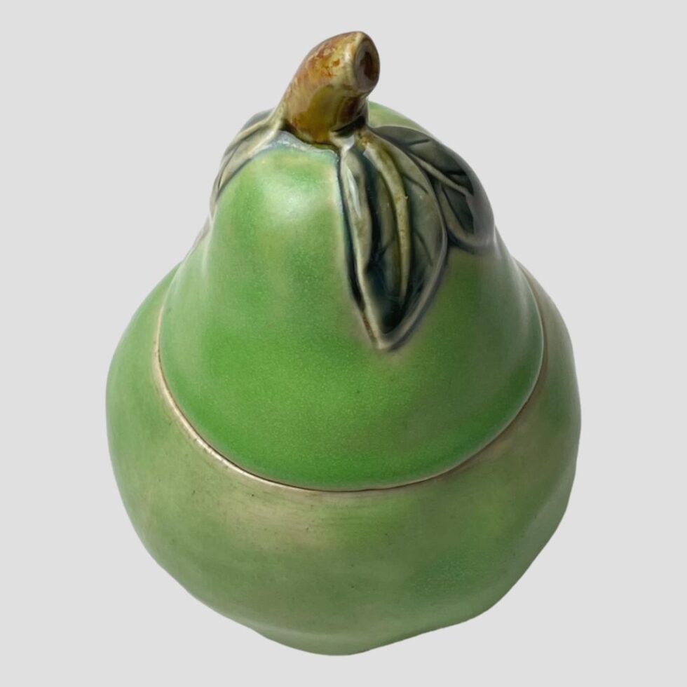 Photo of preserve pot seen with lid in place and from a slightly raised angle looking diagonally down from above. Definitely a Williams pear shape!|