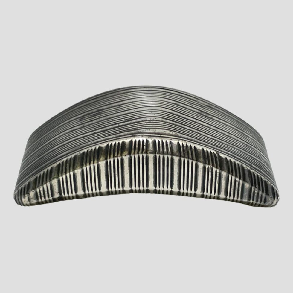 Photo of the snuff box turned upside down to show the engine turned detail on the base.