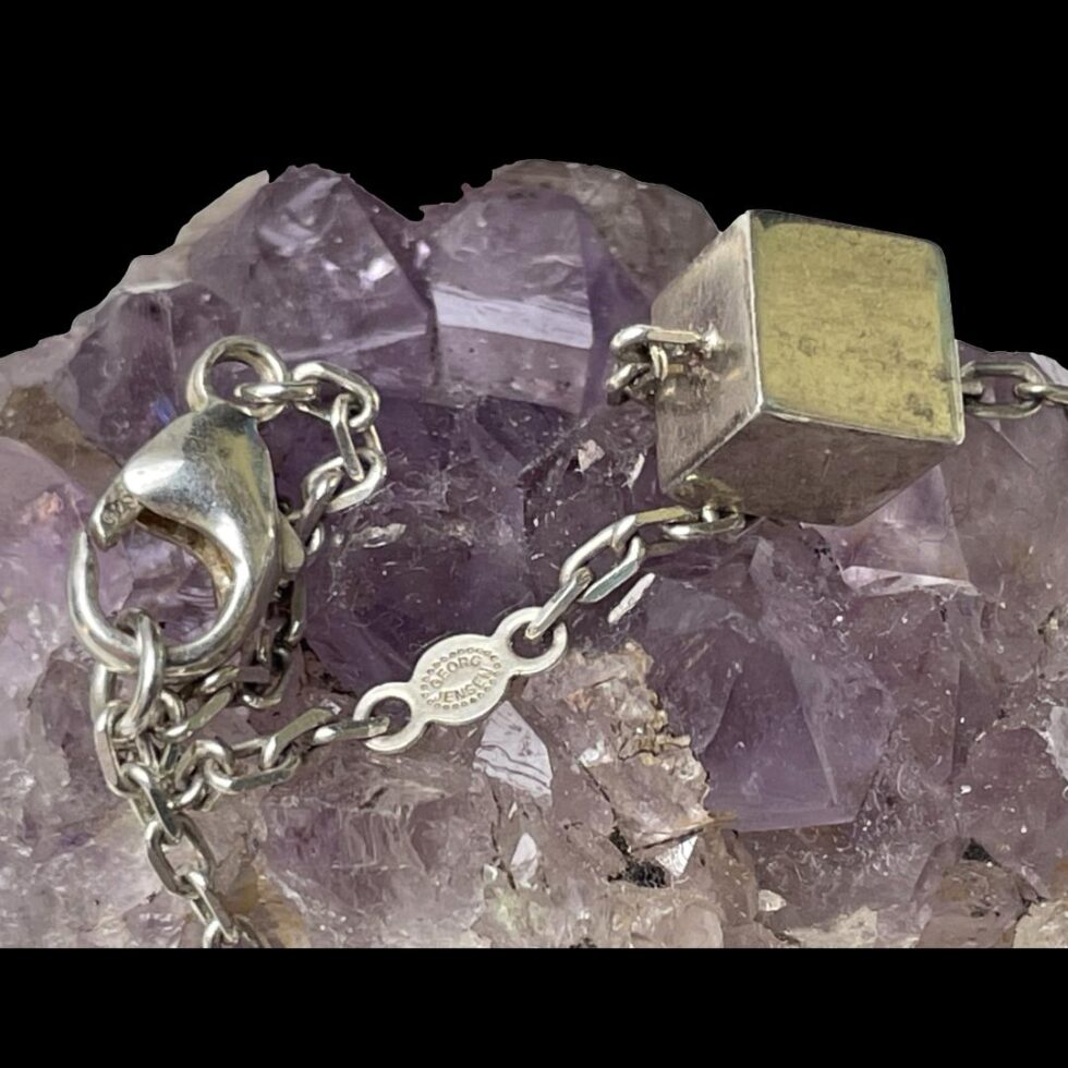 Close up photo of the clasp end of chain showing the hallmark and the Georg Jensen logo.