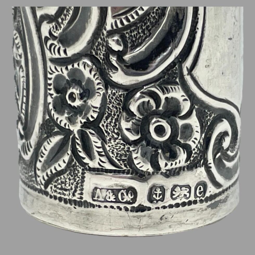 Close up photo of the full hallmark along the bottom of the silver carrier to the right of the cartouche area.