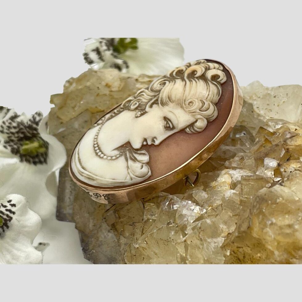 Second photo - cameo is still displayed on top of some river quartz and the shot is taken from the right side of brooch so the ladies gaze is almost upon the beholder!