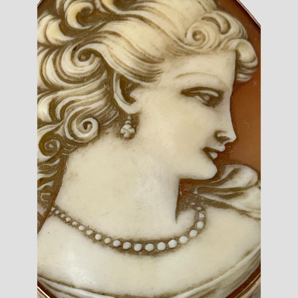 Close up photo of the lovely cameo carving showing the fine details and dreamy gaze of the lady.