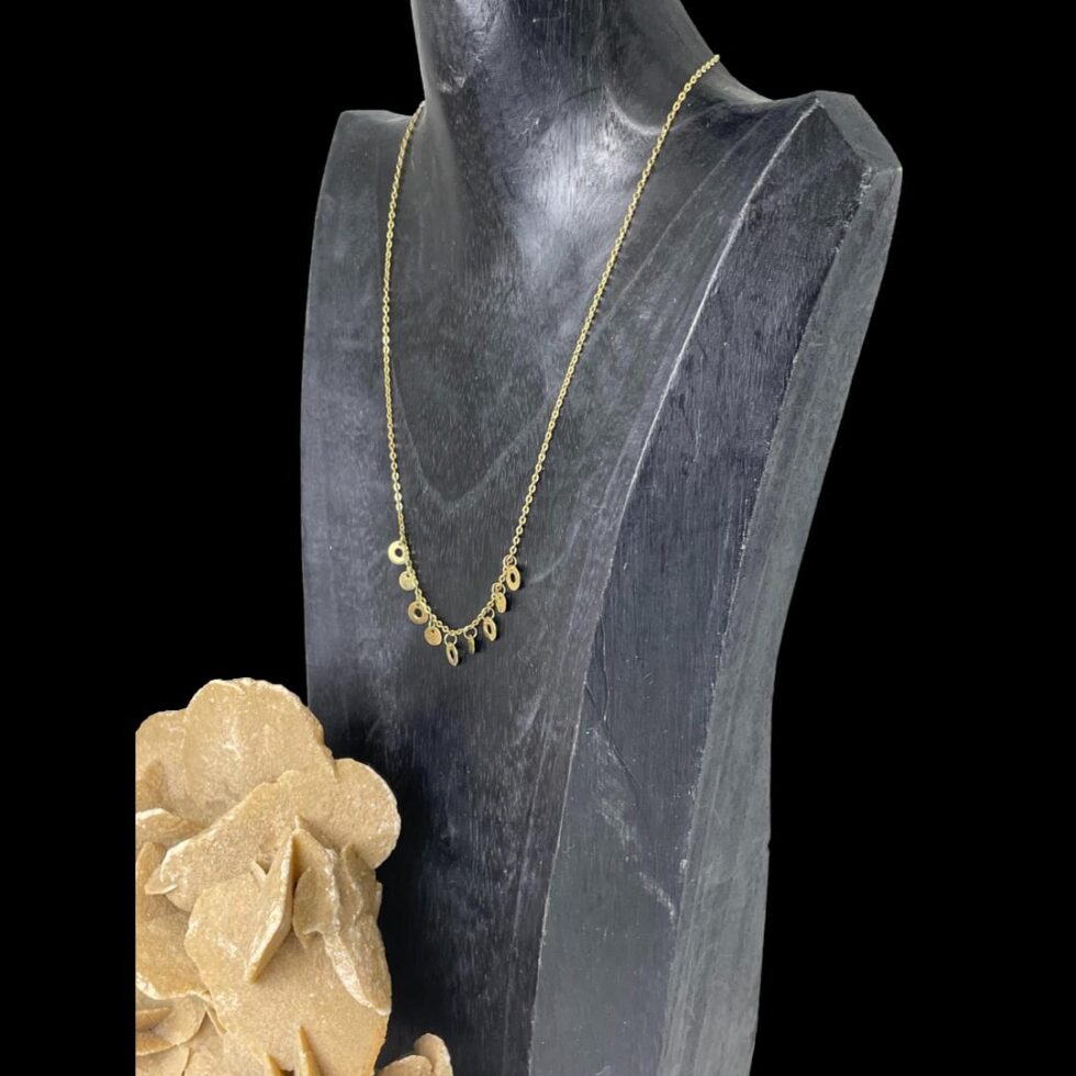 Photo of necklace still displayed on a black display bust with the necklace front facing towards the bottom left corner.