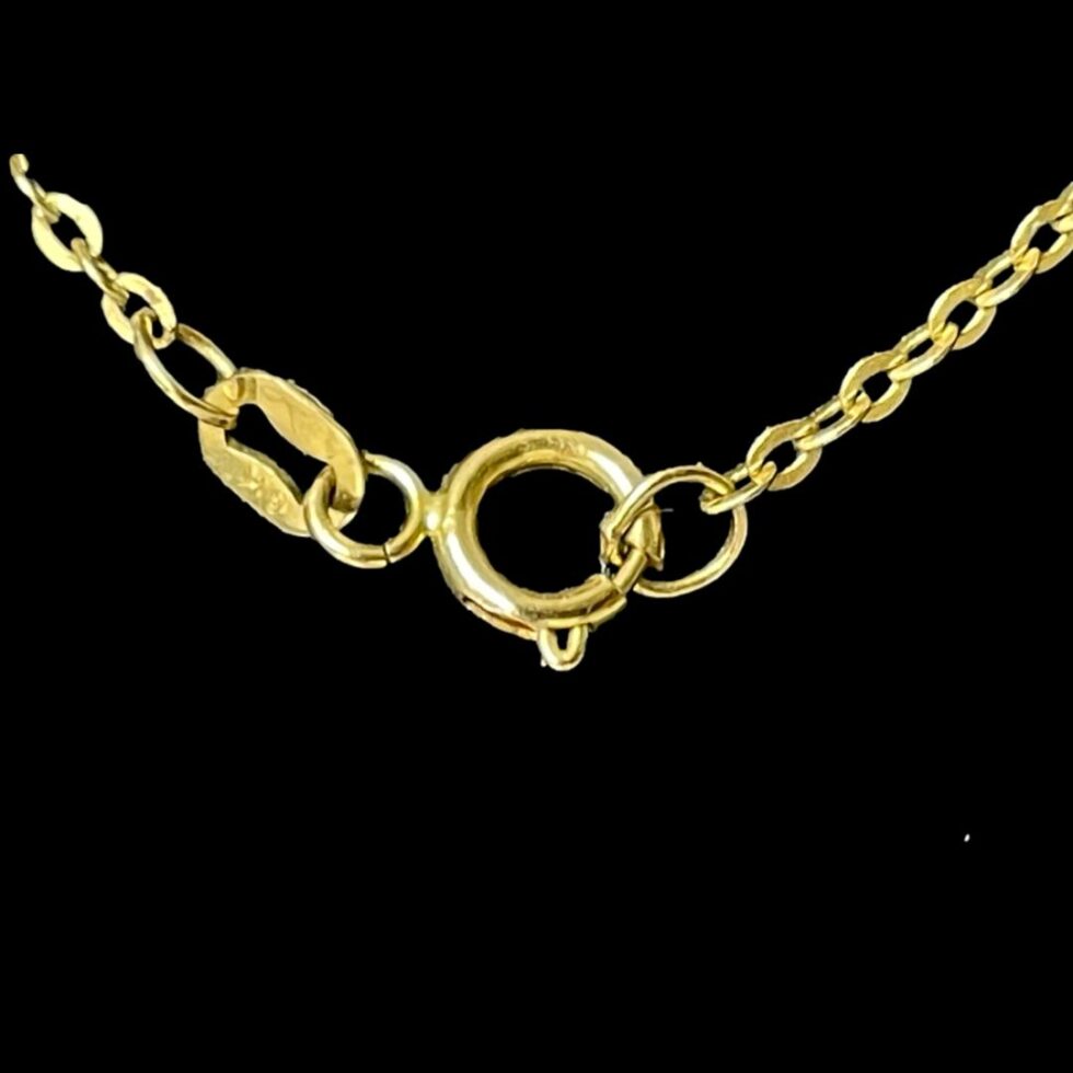 Close up photo of the clasp area of disc necklace showing the hallmark.