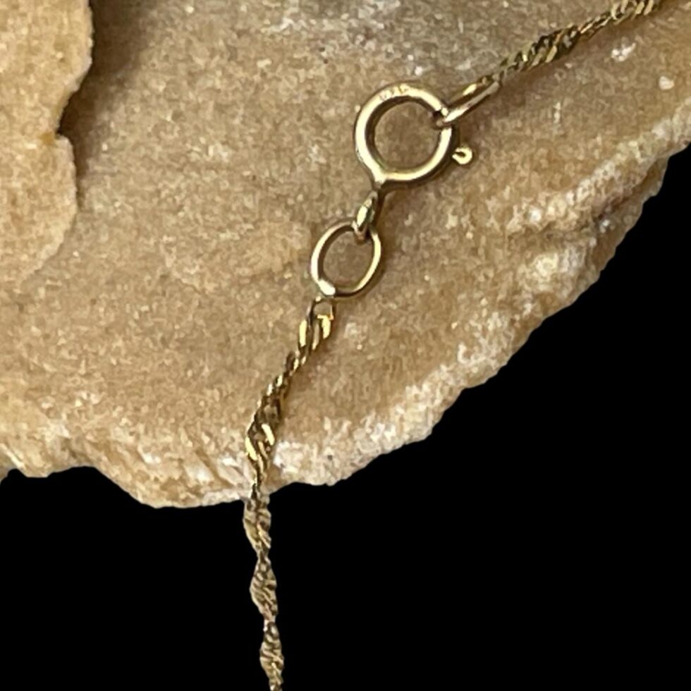 Close up photo of the 9ct hallmark on the chain clasp.