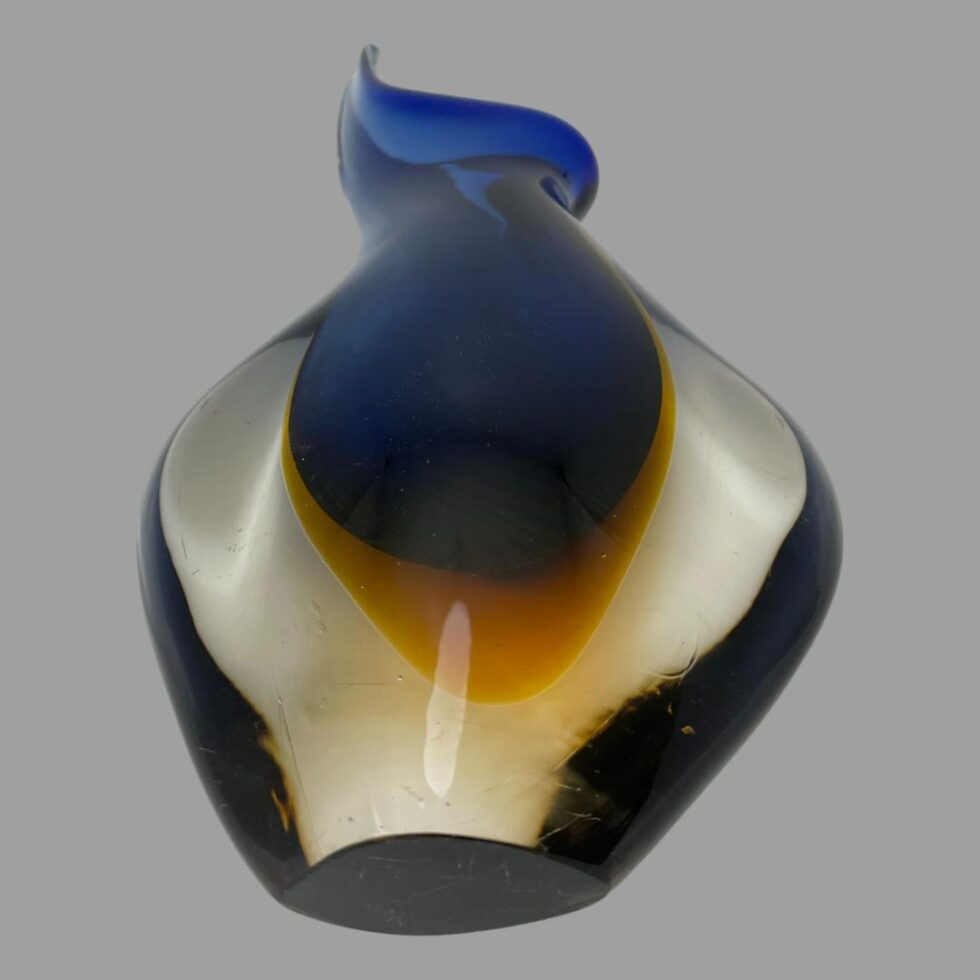Photo of blue sommerso Murano vase laid on its back showing the base and the 3 colours.