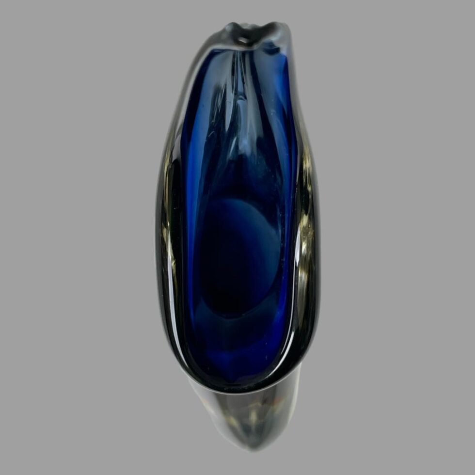 Photo looking down at the vase from above. It is a vase with a slim opening.