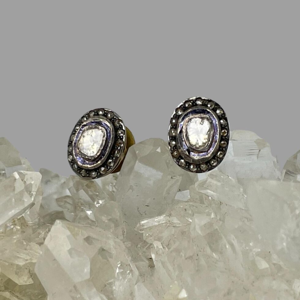 Photo of the rose cut diamond studs now displayed on top of the rock of natural quartz crystal and forward facing - very sparkly!