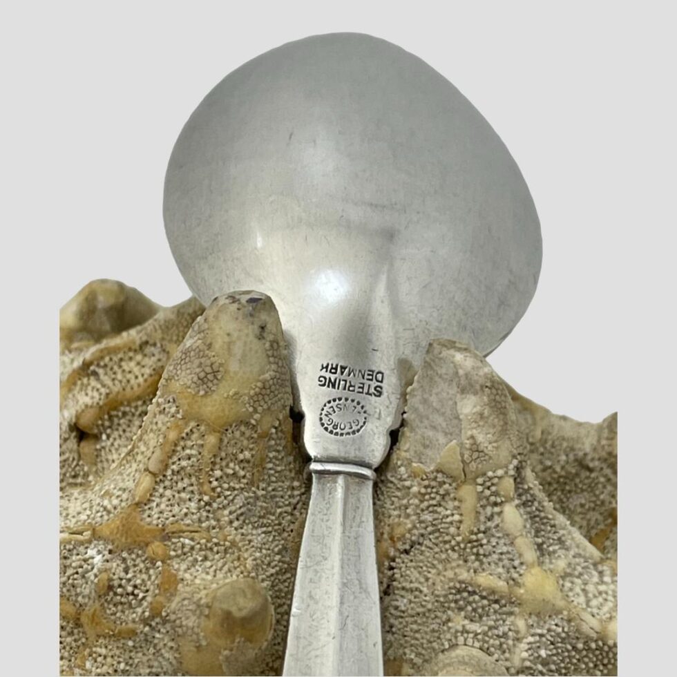 Close up photo of the hallmark and Georg Jensen signature stamp on the back of spoon neck.