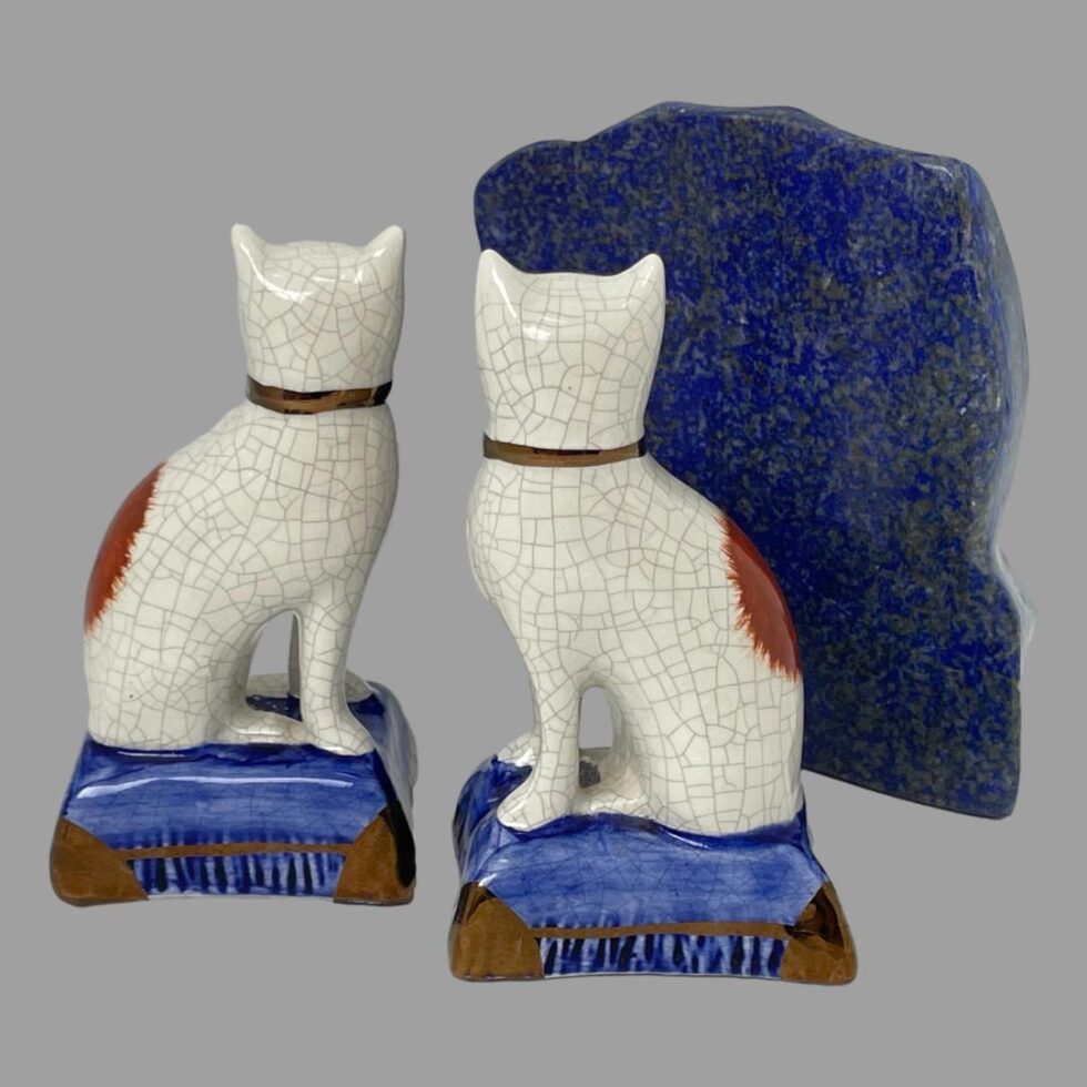 Photo of both Staffordshire cats seen from the back. No terracotta spots on this side just part of the large one on the back visible. The rock of lapis is moved to the right.