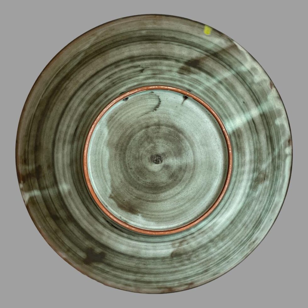 Photo of the back of large flying cranes bowl showing the different shades of grey and the terracotta base rim.