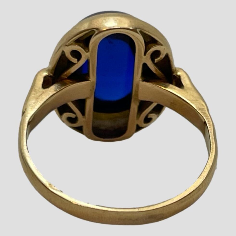 Photo of the back of the spinel ring showing the secure solid setting for the stone.