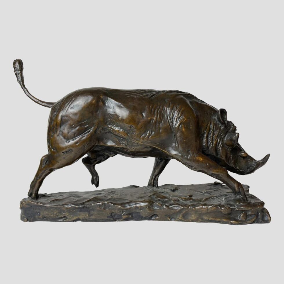 Photo of bronze boar displayed with the board facing right. Its front right leg is raised up as if in motion.