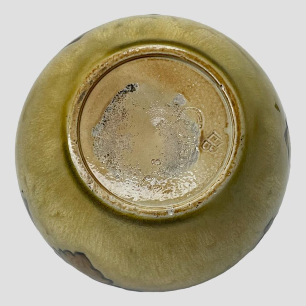 Photo of the base of the vase with debossed Doulton stamp just visible. Initials EB for Ethel Beard can be seen clearly.