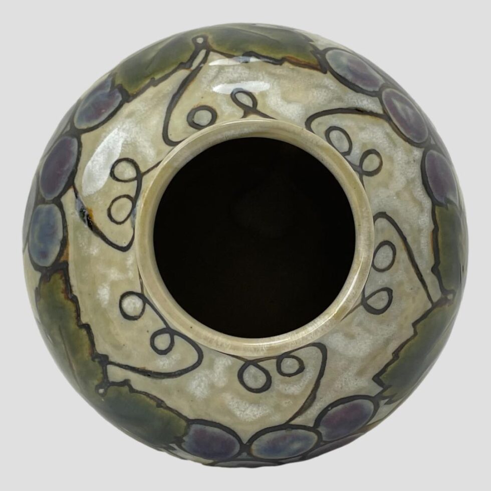 Photo looking straight down at Ethel Beard vase from above. There are uniform curls of vine all around the mouth.