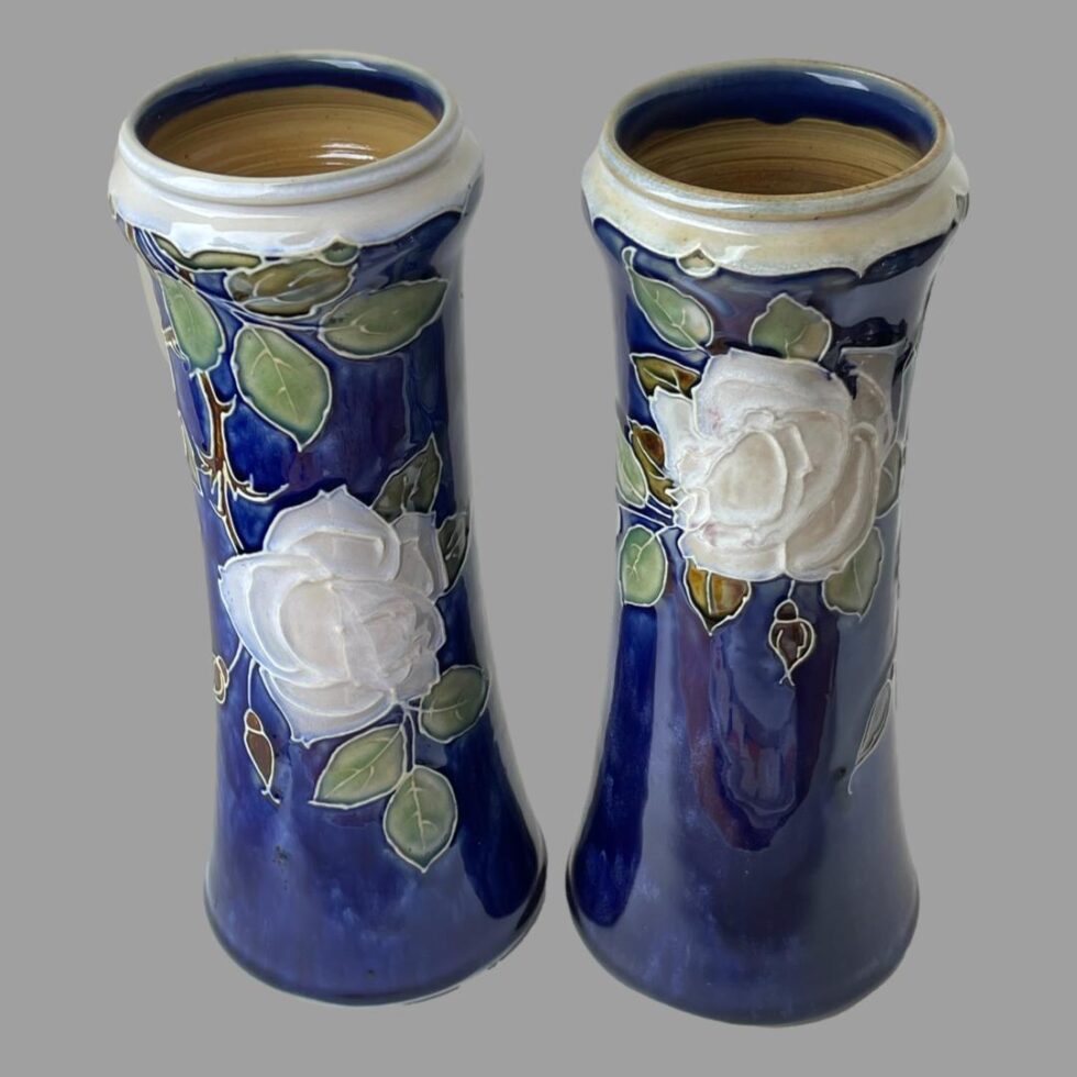 Photo of the tall Doulton vases seen from a slight height looking diagonally down and just peeking into the mouth.