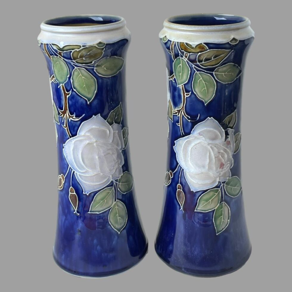 Photo of both vases side by side with the lower rose side on display. They are never an exact match and some minor differences can be seen.