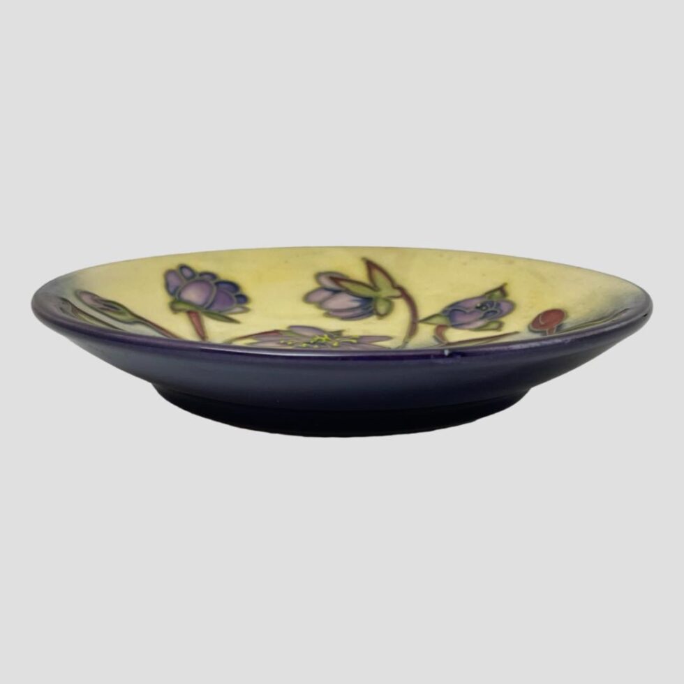 Photo of Moorcroft Hepatica dish seen from a near eye level to show the dish depth.