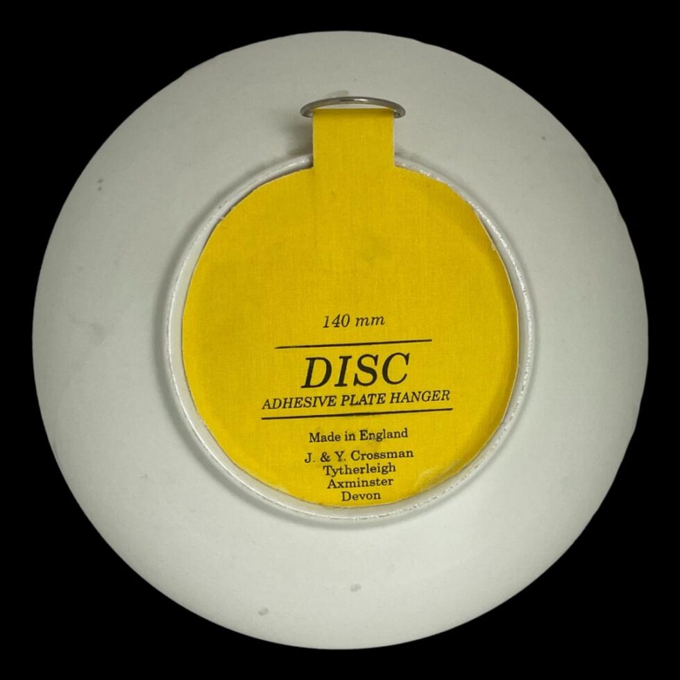 Photo of the back of the large Poole Delphis dish showing the yellow wall hanger dish attached in the centre.