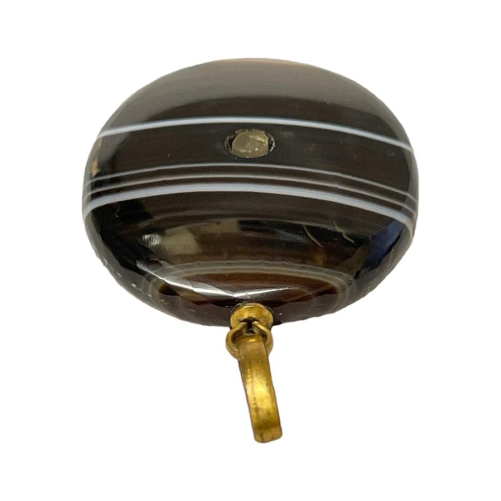 Photo of Stanhope laid flat and this time with the brass bail in the centre foreground.