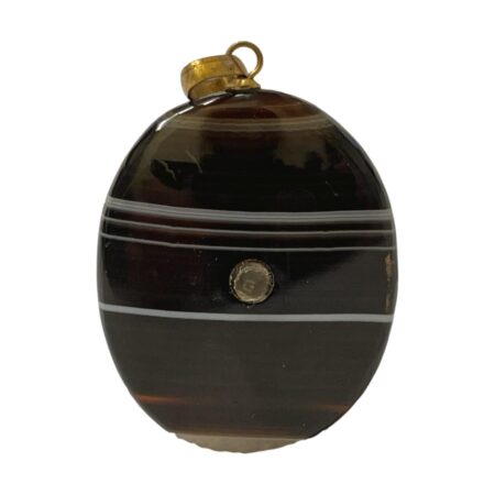 Main photo of banded agate stanhope pendant shown upright and straight on with the Stanhope visible to the centre The agate is a nice plump oblong shape and base colour is a very dark brown with bands of pale grey and lighter browns. Nice natural touch with pale grey patch on the bottom.