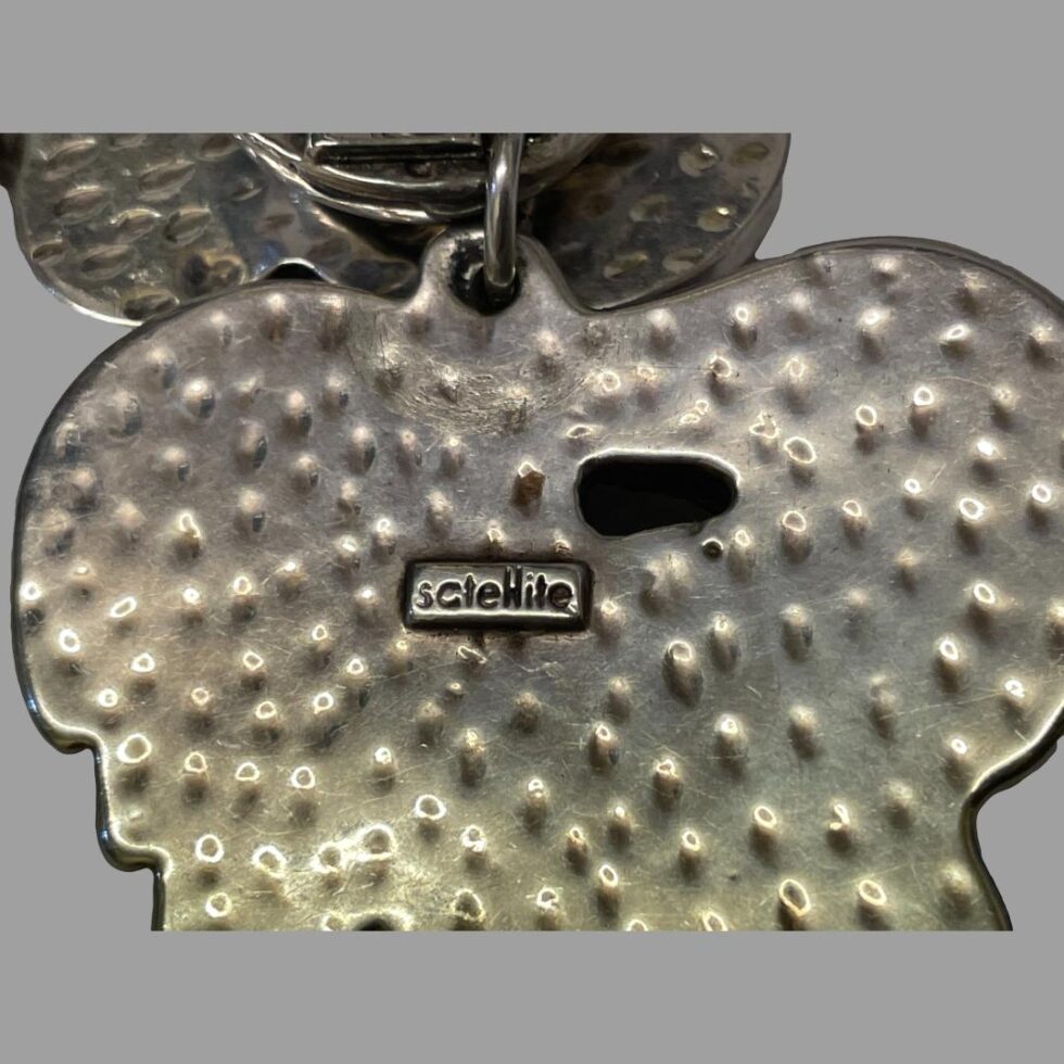 Close up photo of the Satellite stamp on back of one earring.