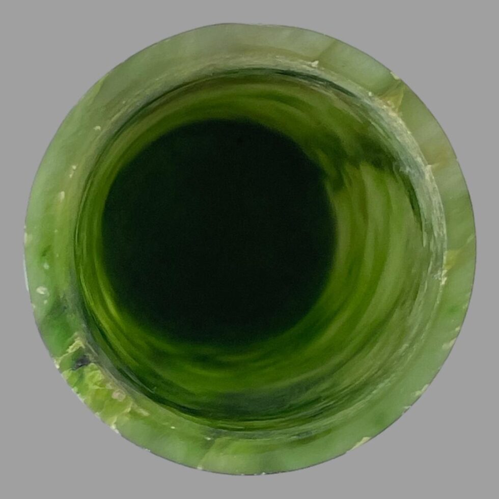 Photo looking straight down into the mouth of the brush pot.