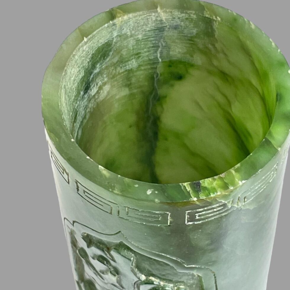 A close up of the inside area of jade brush pot where the external line is visible but not in the inside.