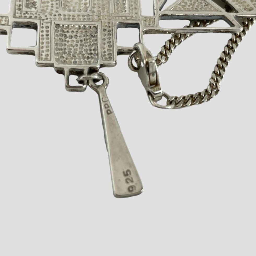 Close up photo of the 925 hallmarks on the back of teardrop piece and to the clasp neck.