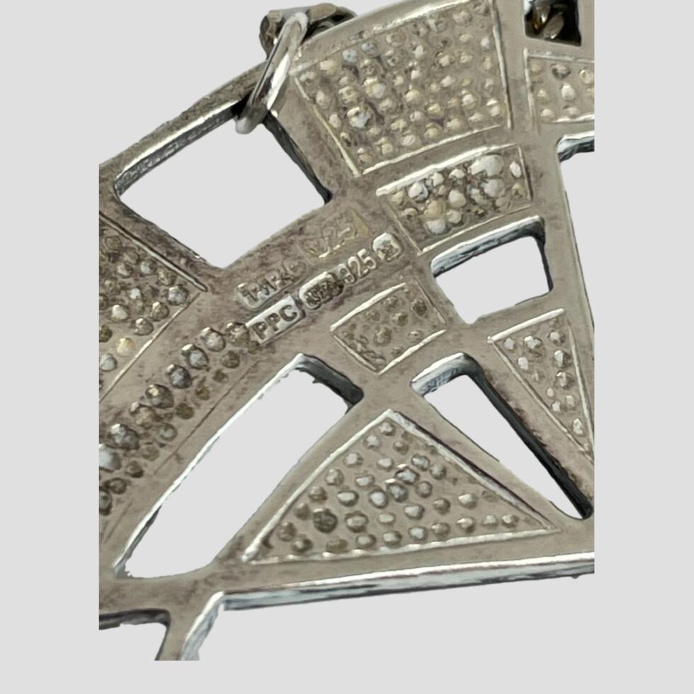 Close up photo of the hallmark on the back of the pendant area.