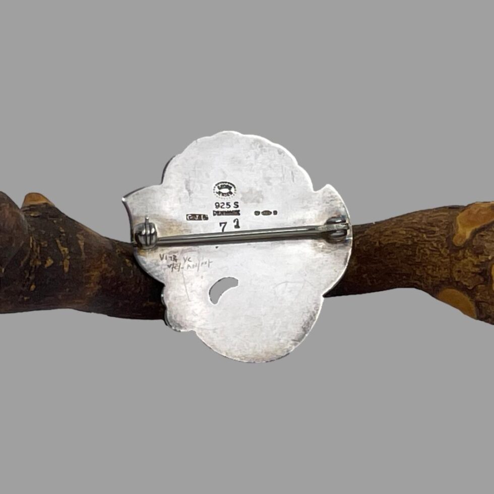 Photo of the back of Georg Jensen floral brooch showing the hallmarks.