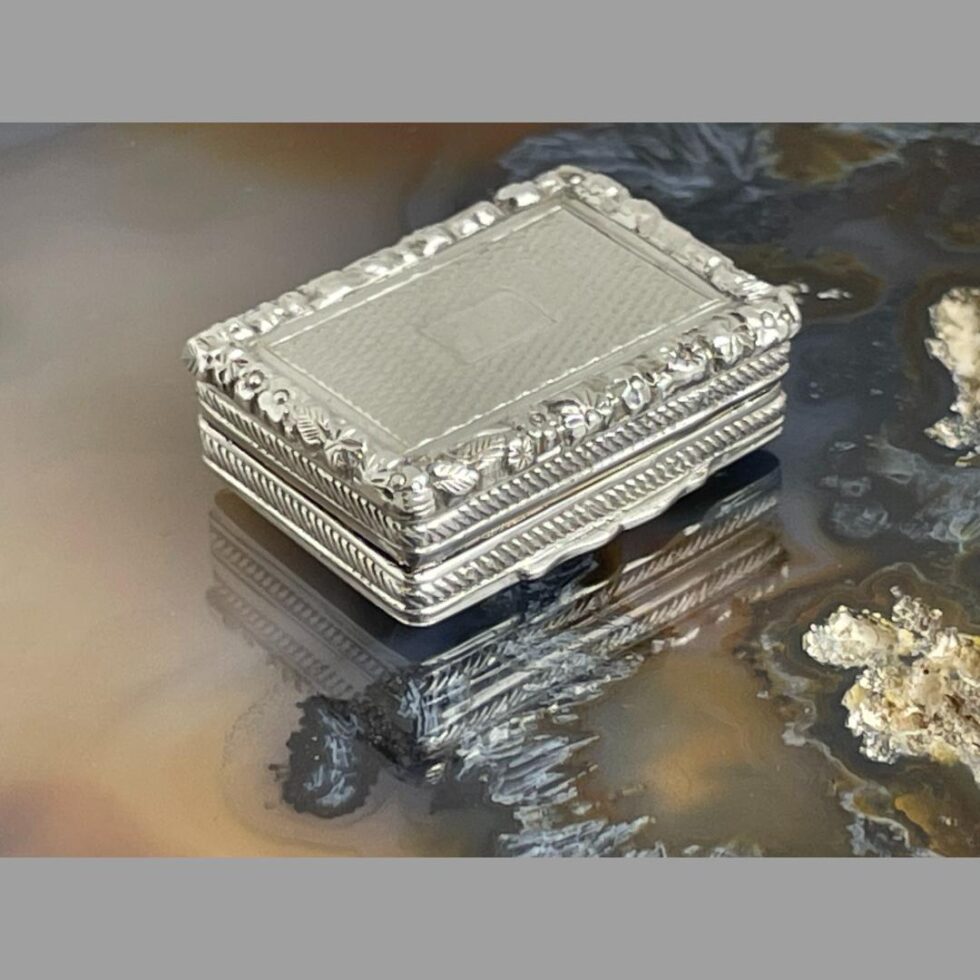 Photo of silver vinaigrette this time with the opening front side facing the bottom right corner.